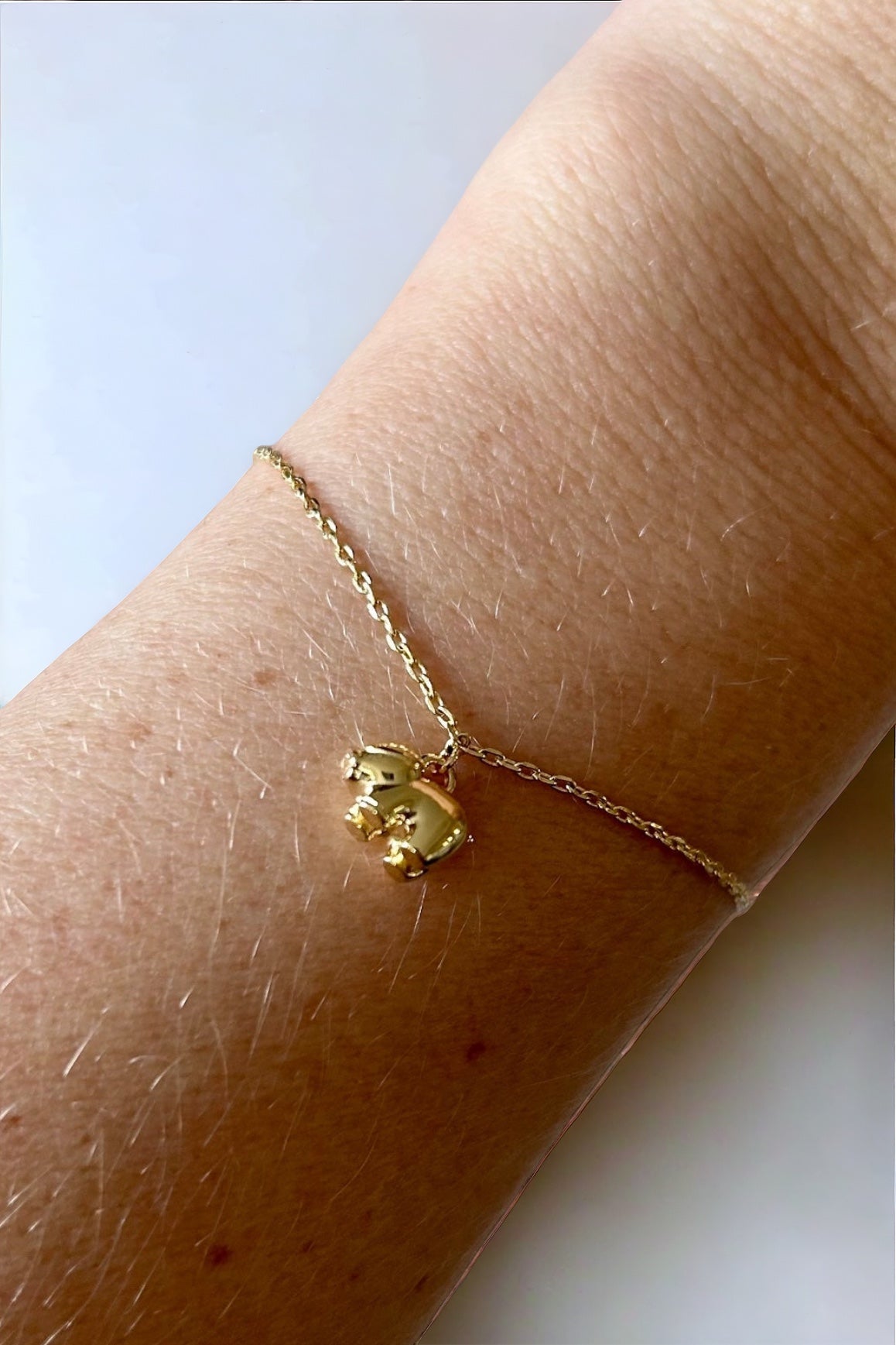 Bracelet en or avec petit cochon taille adulte